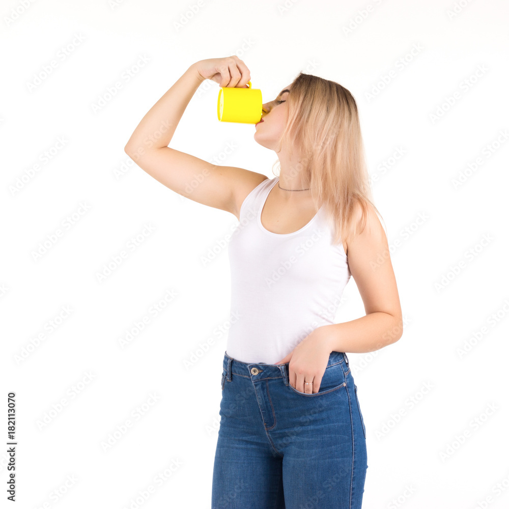 Young cute woman drinks coffee or tea, isolated Young cute woman drinks coffee or tea, isolated