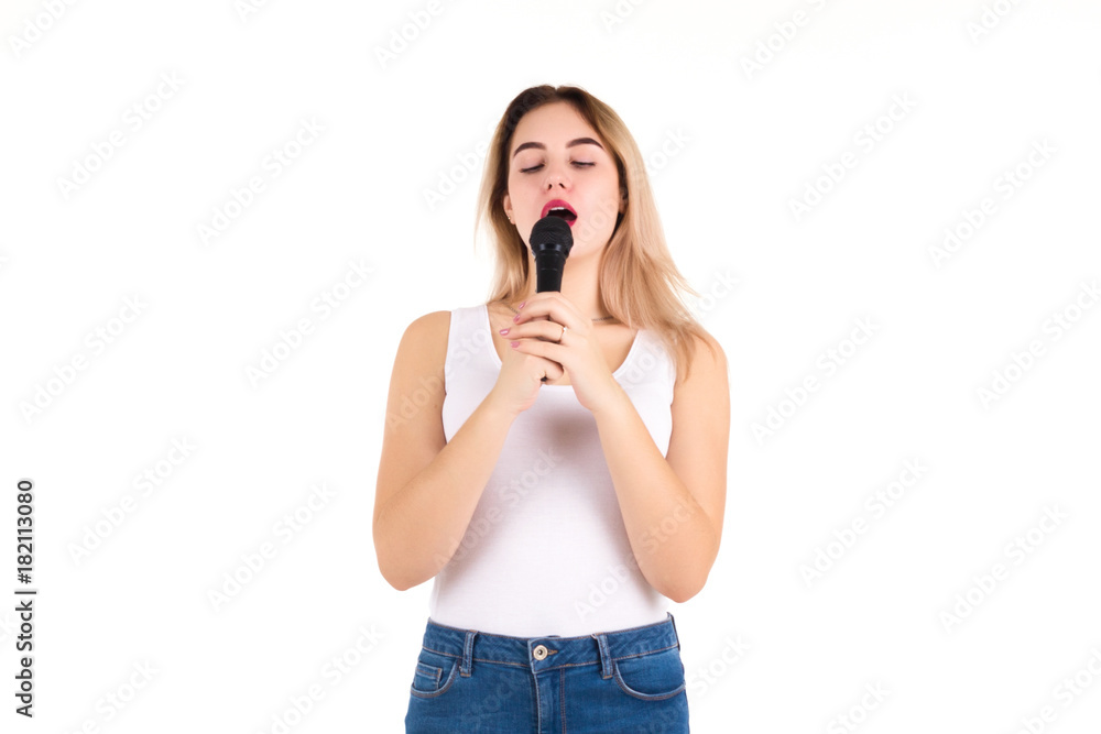 Young cute girl with microphone, isolated Young cute girl with microphone, isolated