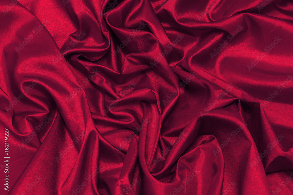 Close up of the luxury cloth or liquid wave or wavy folds of grunge silk texture satin velvet material or luxurious Christmas background or elegant wallpaper design, Red Canvas for Background. Close up of the luxury cloth or liquid wave or wavy folds of grunge silk texture satin velvet material or luxurious Christmas background or elegant wallpaper design, Red Canvas for Background.