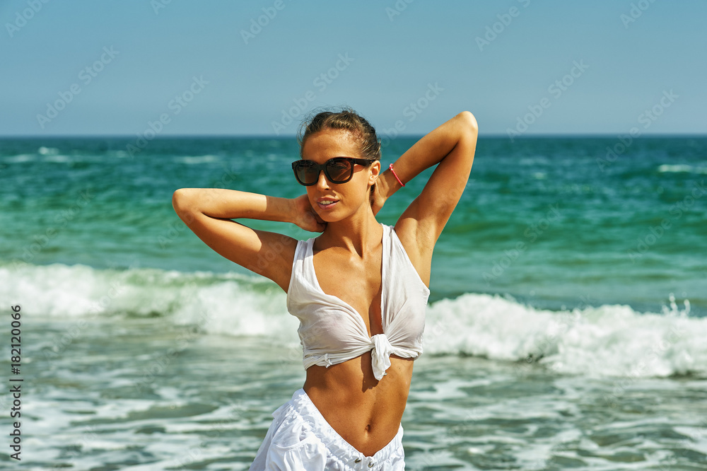 young beautiful woman on sea coast young beautiful woman on sea coast