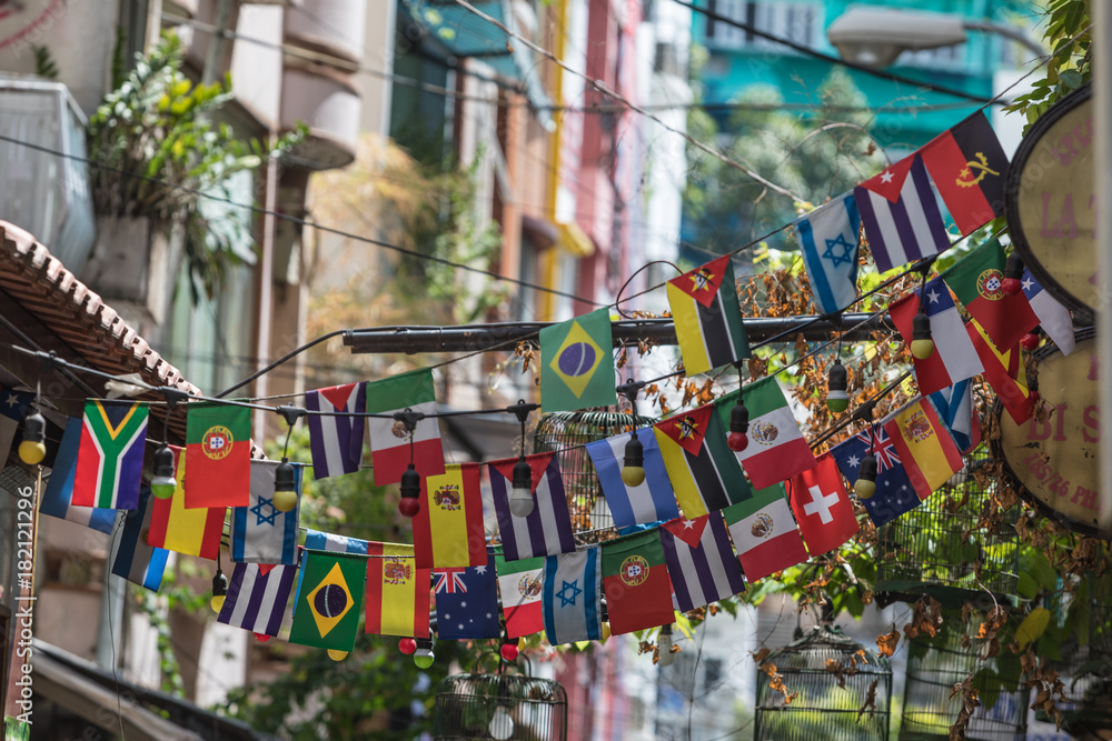 Fototapeta premium Lot of different country flags hanging in the street