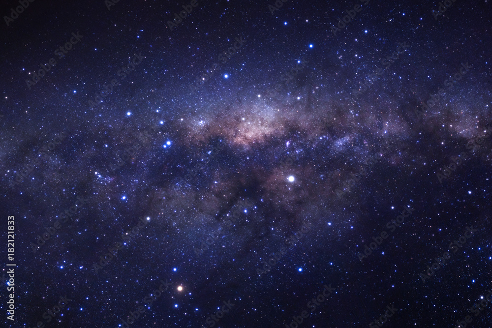 Naklejka premium Milky way galaxy with stars and space dust in the universe, Long exposure photograph, with grain.