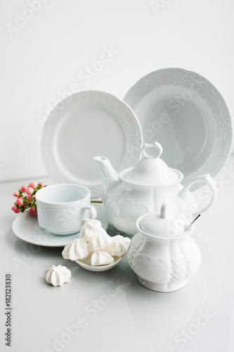 Porcelain tea set on white background. Luxury exquisite and expensive crockery concept