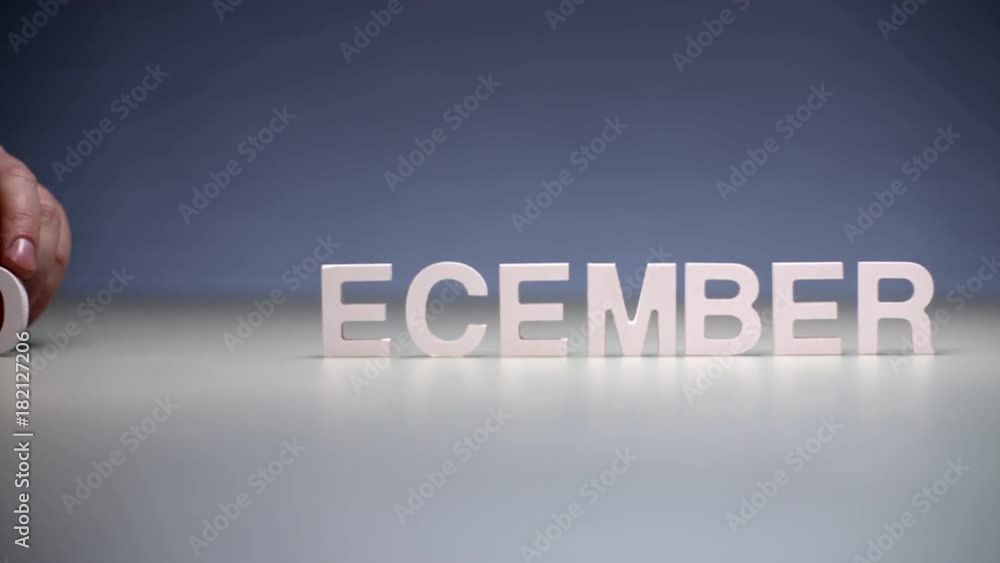 Male hand composition word december. Winter months on calendar and seasons year Male hand composition word december. Winter months on calendar and seasons year