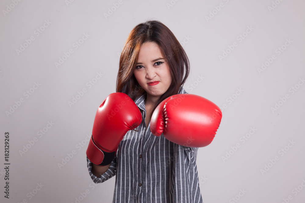 Young Asian woman with red boxing gloves. Young Asian woman with red boxing gloves.