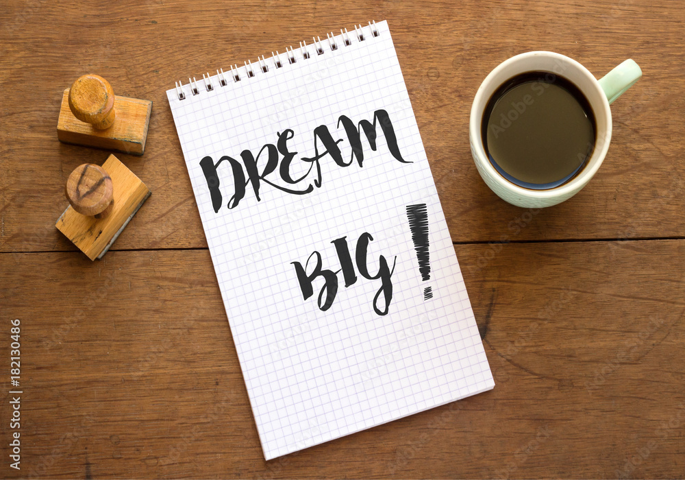 DREAM BIG Motivational concept, on notebook DREAM BIG Motivational concept, on notebook
