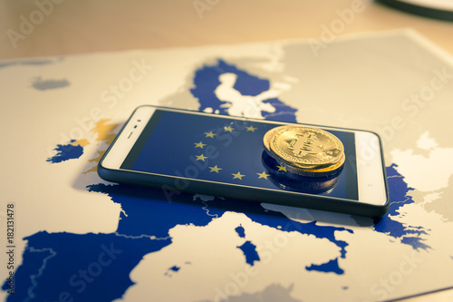 Canvastavla Financial concept with golden Bitcoin over smartphone, EU flag and map