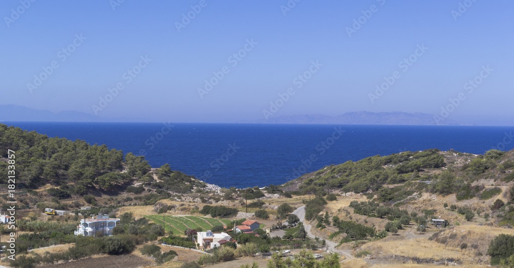 High angle view of blue sea and rocks