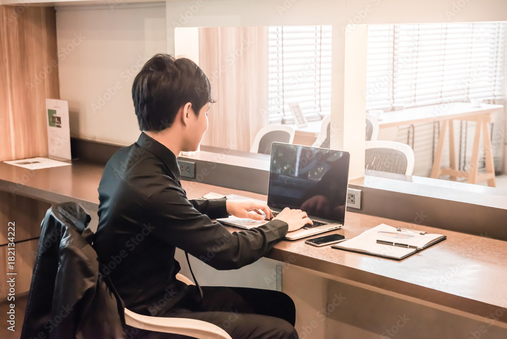 businessman working with labtop or notebook and calculator on the table at office. businessman working with labtop or notebook and calculator on the table at office.