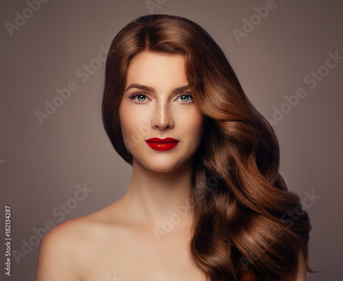 Young Woman with Long Healthy Wavy Hairstyle. Girl with Colored Hair, Haircare Concept