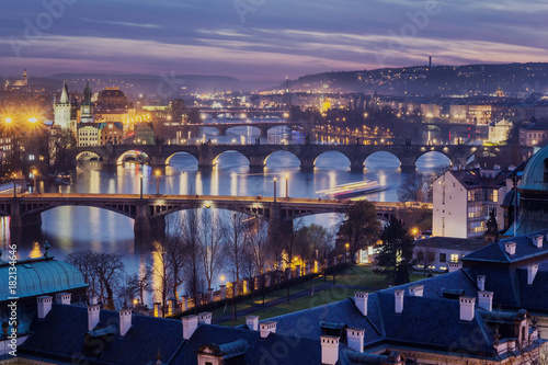 Photography View of the Vltava River and the bridges shined with the sunset sun, Prague