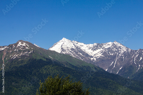 snow-capped mountain peaks against the blue sky