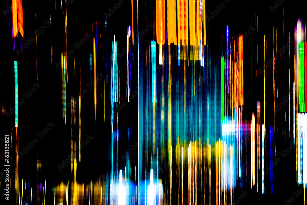 Abstract of multicolored city lights beams in motion, Moving colorful lines or light painting LED building abstraction on busy city Light trails, Rainbow and chaos black background. Vertical desigh Abstract of multicolored city lights beams in motion, Moving colorful lines or light painting LED building abstraction on busy city Light trails, Rainbow and chaos black background. Vertical desigh