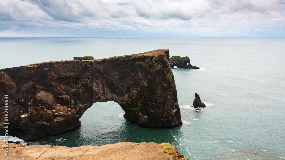 view of stone arch on Dyrholaey cape in Iceland