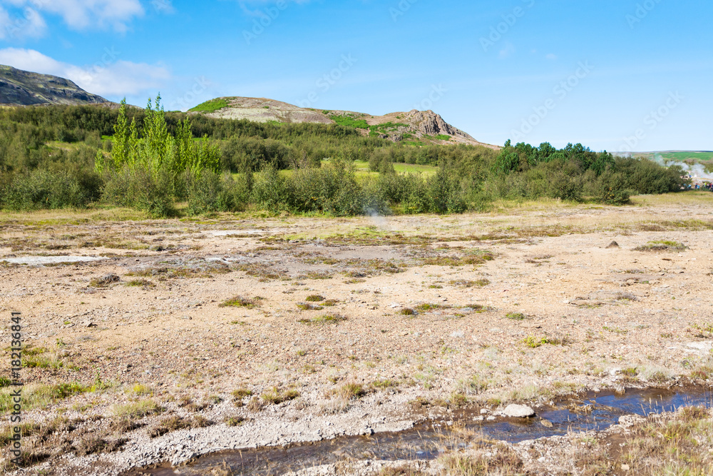 Naklejka premium stream in Haukadalur hot spring valley in Iceland