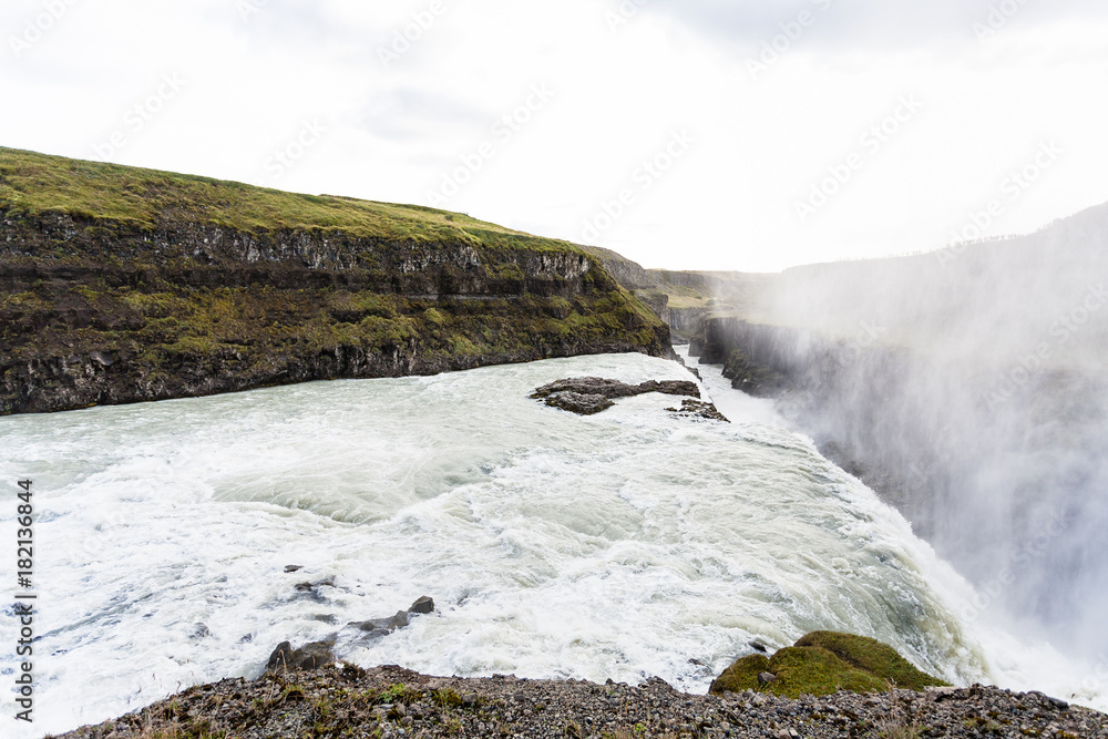 Gullfoss waterfall and water spray over canyon Gullfoss waterfall and water spray over canyon