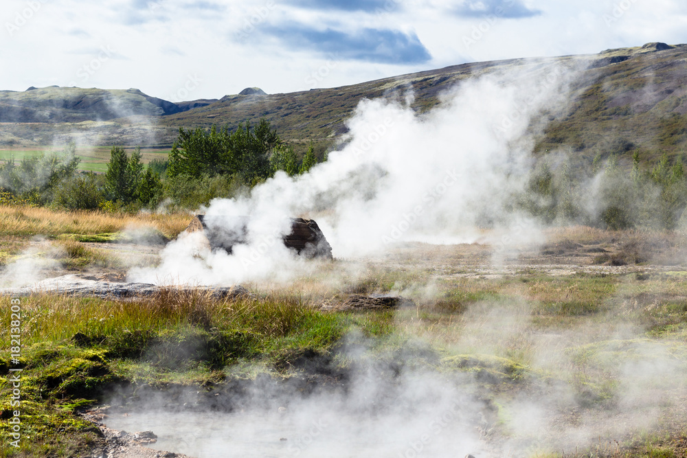 many geysers in Haukadalur valley in Iceland many geysers in Haukadalur valley in Iceland