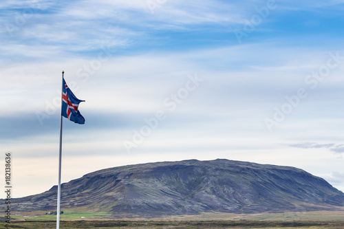 icelandic flag and view of mount in Iceland
