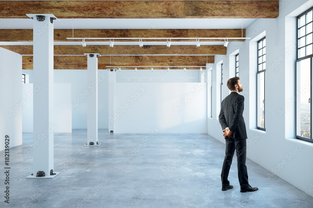 Fototapeta premium Man in empty room