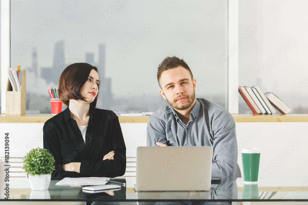 Attractive male and female working on project Attractive male and female working on project