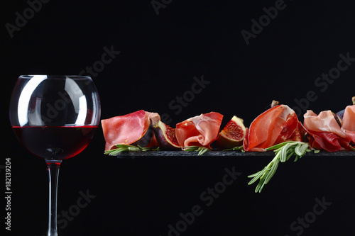 Prosciutto and red wine .