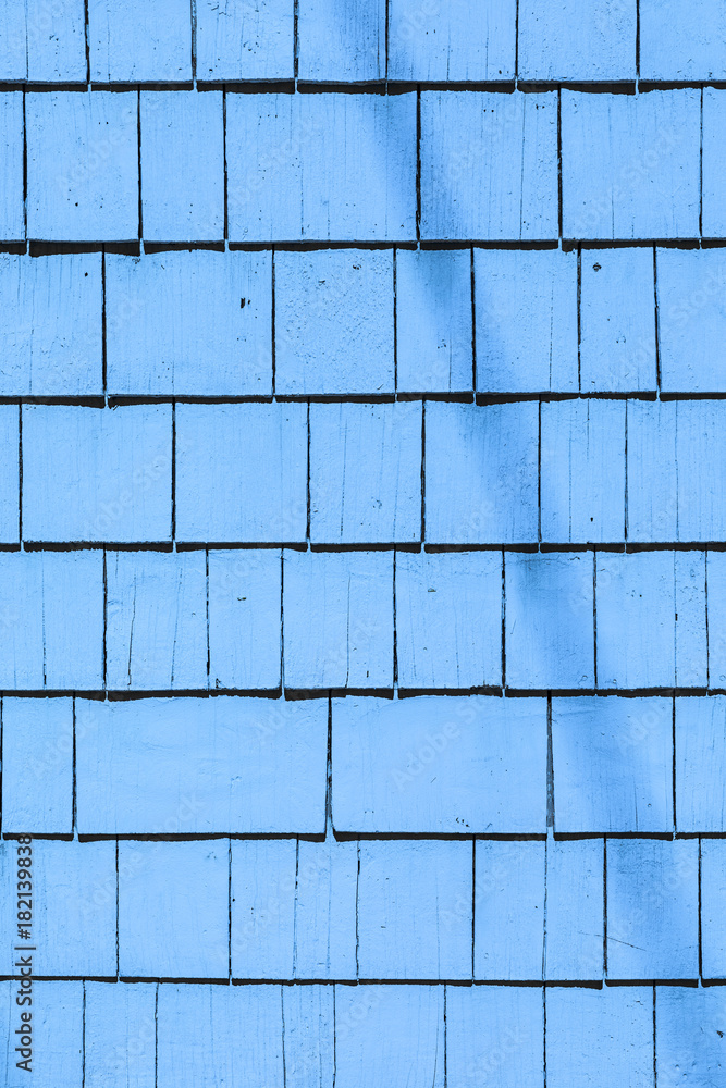 blue painted wooden shingles at the roof blue painted wooden shingles at the roof