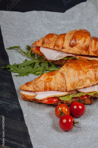 Konstfotografi Close up of tasty croissants with tomatoes
