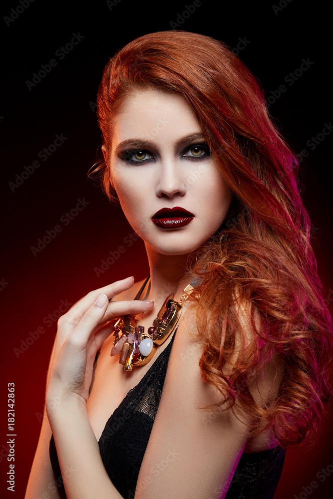 Fototapeta premium beautiful girl with bright makeup and red hair