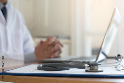Doctor working on laptop computer