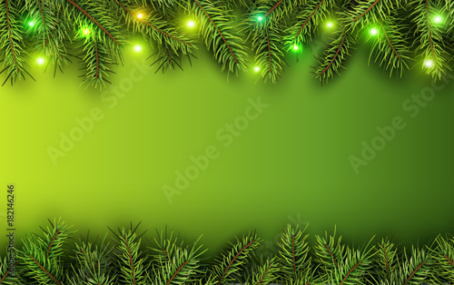 Christmas background green fir tree branches and lights