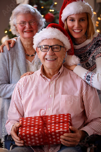 Christmas portrait - family with wearing Santa caps.
