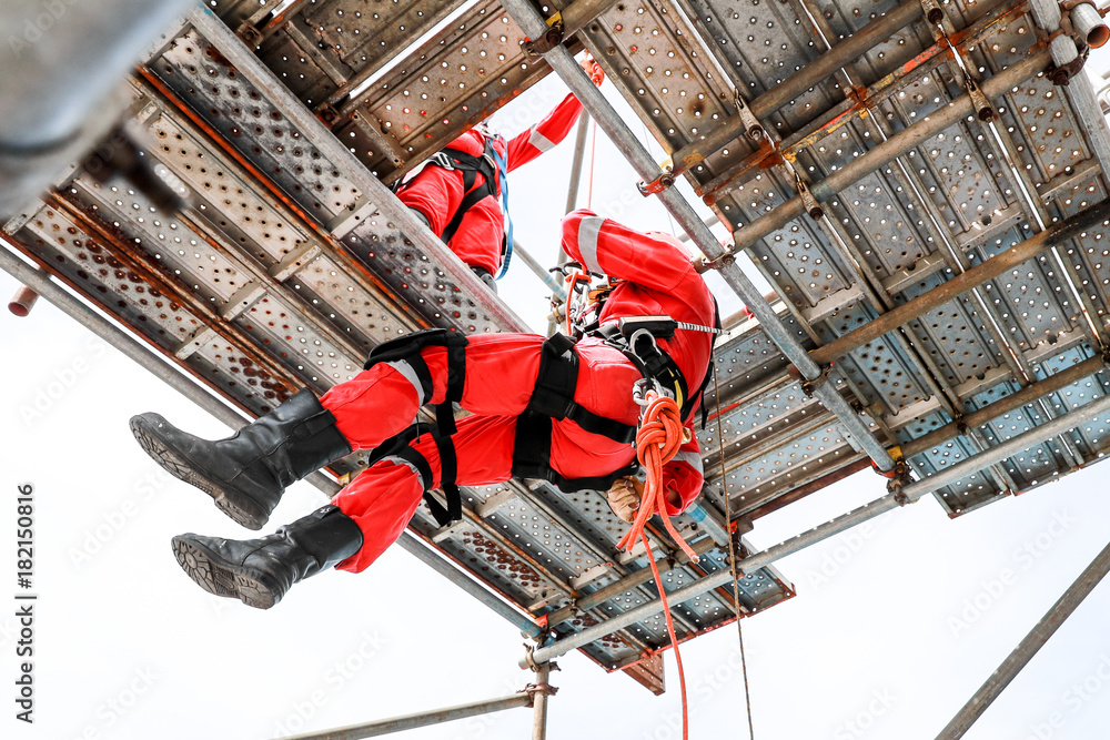 Work at height by rope access - obrazy, fototapety, plakaty 