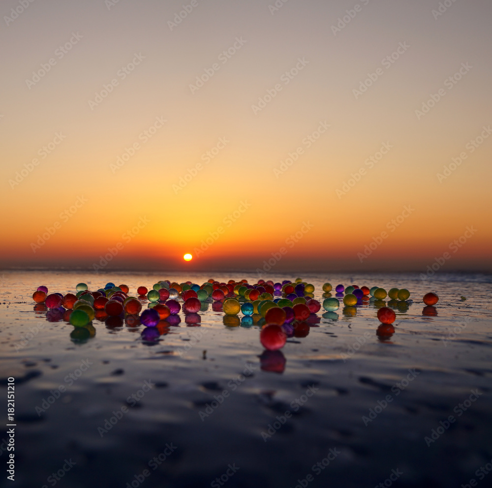 colored balls on the ice of the sea of Japan colored balls on the ice of the sea of Japan