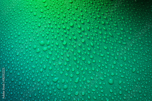 Water Drops On Green Background.