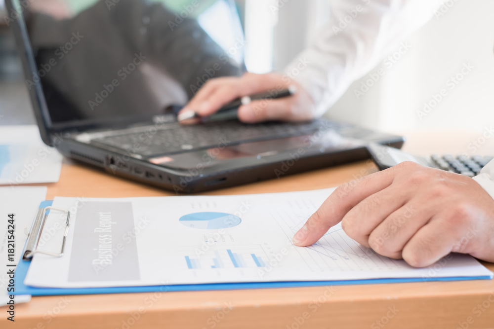Businessman analyzing investment charts. Accounting Businessman analyzing investment charts. Accounting