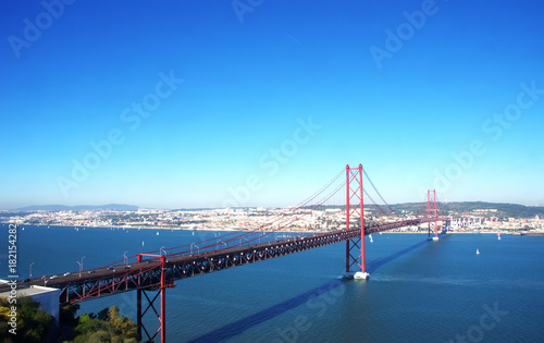 25th of April bridge over Tagus river with Lisbon on background