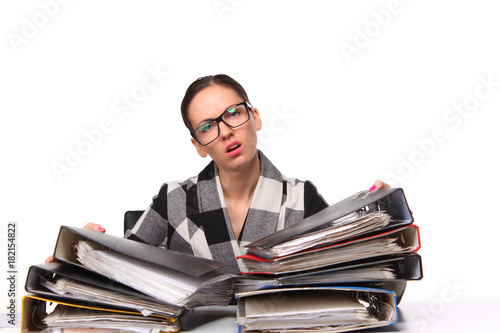 Female office worker  sitting at the desk with papers document. Tired and exhousted business woman. photo