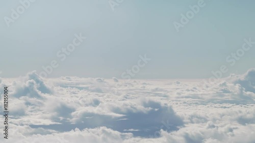 Wallpaper Mural aerial shot from plane flying above the clouds in daytime Torontodigital.ca