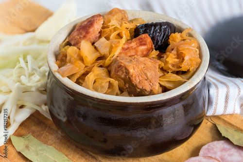 Bigos-traditional Polish dish of finely chopped meat, mushrooms, and sausage with sauerkraut and shredded fresh cabbage. The dish is also traditional for Belarusian, Ukrainian and Lithuanian cuisine. photo