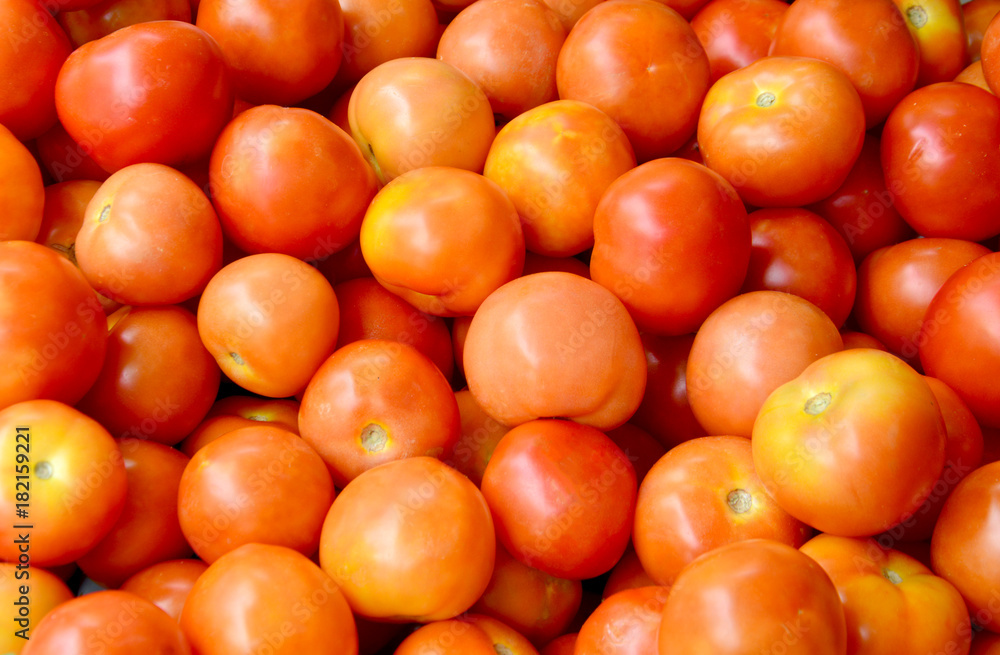 Delicious red tomatoes. Organic tomatoes. Fresh tomatoes. It can be used as background. (selective focus) Delicious red tomatoes. Organic tomatoes. Fresh tomatoes. It can be used as background. (selective focus)