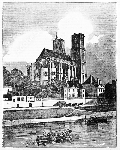 Ancient european church and a river foreground. Collegiate Church of Our Lady in Mantes-la-Jolie, France. Old Illustration by Jackson, published on Magasin Pittoresque, Paris, 1834 photo