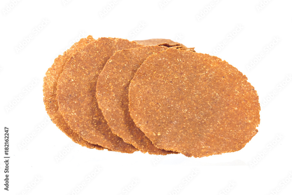 Dry and sheet of Soybean fermented on white background. Dry and sheet of Soybean fermented on white background.