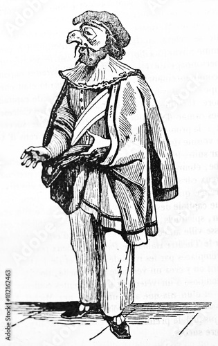 Pulcinella, classical Italian character in his traditional costume standing isolated on floor. Old Illustration by unidentified author published on Magasin Pittoresque Paris 1834 photo