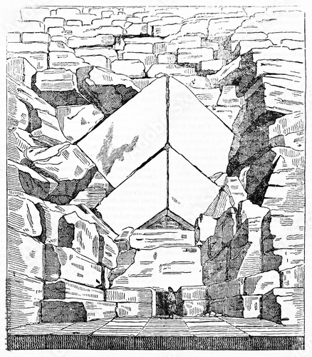Ancient majestic view of the entrance of Great Pyramid of Giza Egypt. Small person compared with the stones large size. Old Illustration by unidentified author, Magasin Pittoresque Paris 1834