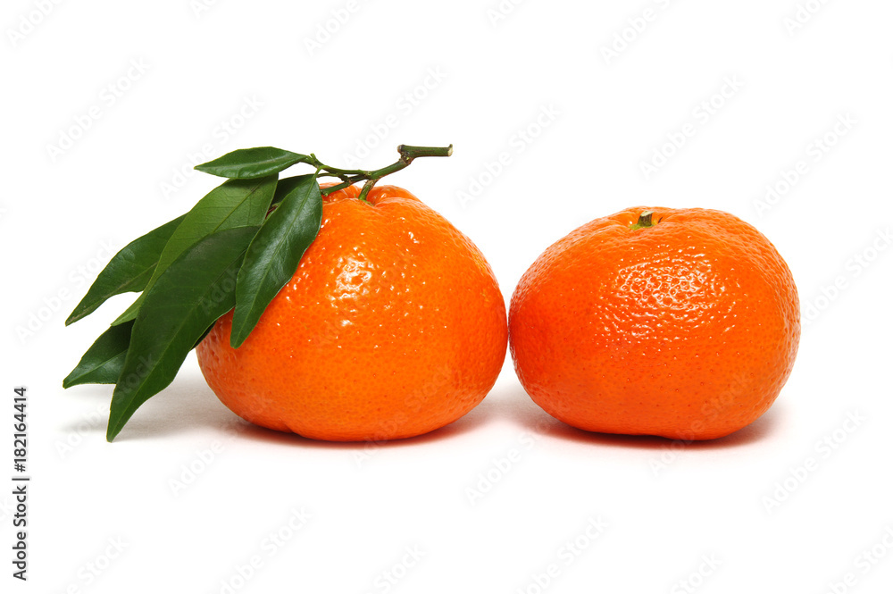 Tangerine or clementine with green leaf Tangerine or clementine with green leaf