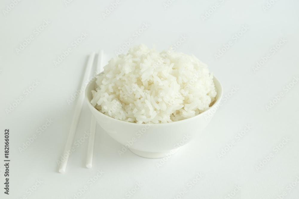 RICE BOWL AND CHOPSTICKS
Steamed rice in a white bowl served with white chopsticks on a white background. RICE BOWL AND CHOPSTICKS
Steamed rice in a white bowl served with white chopsticks on a white background.