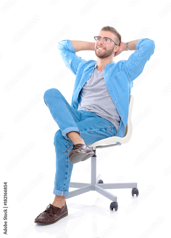 Young man sitting on the chair isolated over white background. Startupper. Young entrepreneur. Young man sitting on the chair isolated over white background. Startupper. Young entrepreneur.