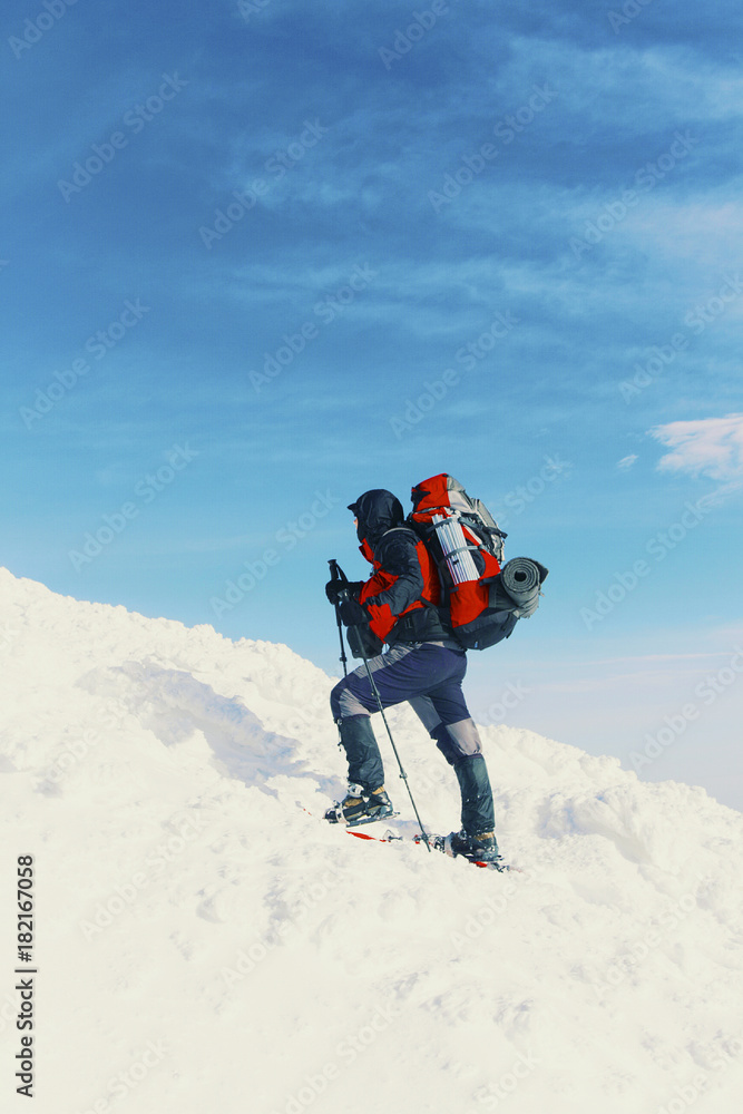 Winter hike in the mountains with a backpack and tent. Winter hike in the mountains with a backpack and tent.