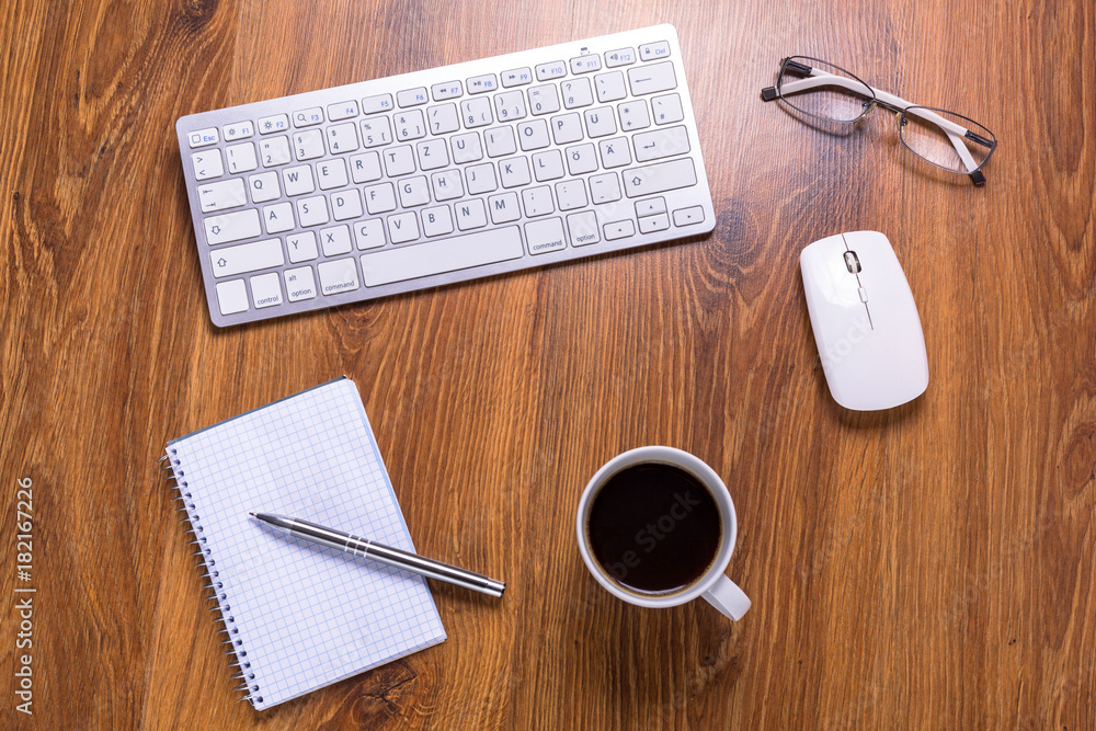 Modern office workplace with a cup of coffee Modern office workplace with a cup of coffee
