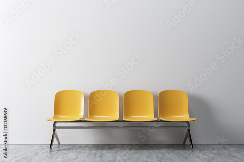 White room, yellow chairs